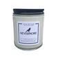A white candle with the label "Nevermore" and a raven on the label. There is a white background.